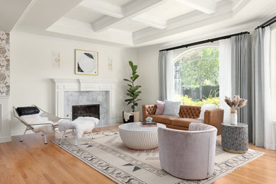 Example of a large open concept medium tone wood floor, beige floor and coffered ceiling living room design in San Francisco with white walls, a standard fireplace and a stone fireplace