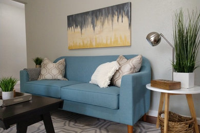 Living room - mid-sized 1960s medium tone wood floor living room idea in Dallas with gray walls