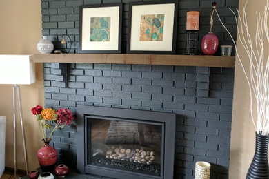 Example of a mid-century modern living room design in Minneapolis with a standard fireplace and a brick fireplace