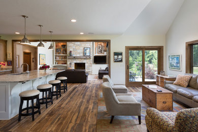 Living room - large farmhouse medium tone wood floor and brown floor living room idea in Milwaukee