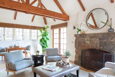 Inspiration for a mid-sized transitional living room remodel in Santa Barbara with white walls, a standard fireplace, a stone fireplace and no tv