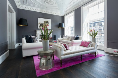 Medium sized traditional enclosed living room in Edinburgh with grey walls, dark hardwood flooring, a standard fireplace and brown floors.