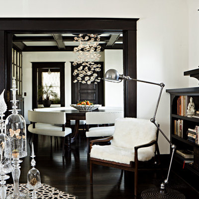 Elegant black floor living room photo in Portland with white walls
