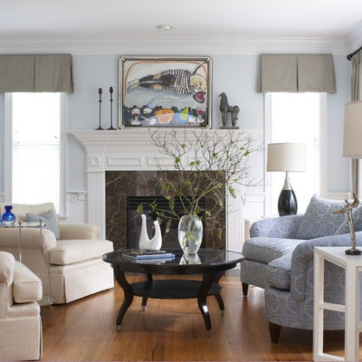 Elegant living room photo in Bridgeport with blue walls and a standard fireplace