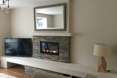 Contemporary living room in Other with a standard fireplace and a tiled fireplace surround.