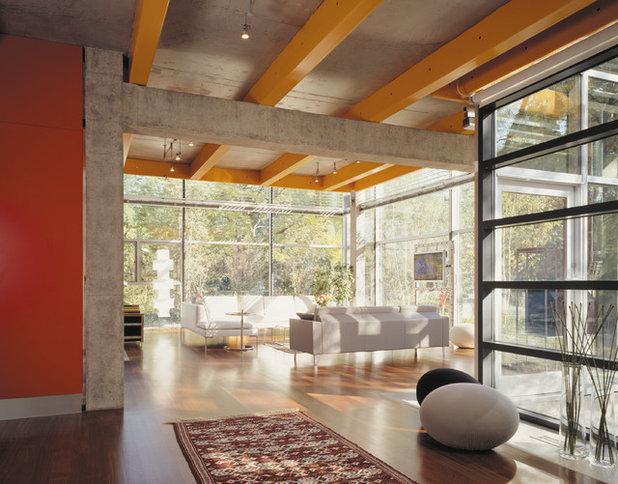 Industrial Living Room by Thomas Roszak Architecture, LLC
