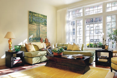 Example of a large trendy formal and open concept dark wood floor living room design in New York with beige walls, no fireplace and no tv