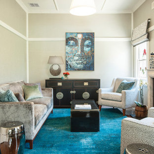This is an example of a mid-sized asian enclosed living room in Melbourne with grey walls, medium hardwood floors, a standard fireplace and a stone fireplace surround.