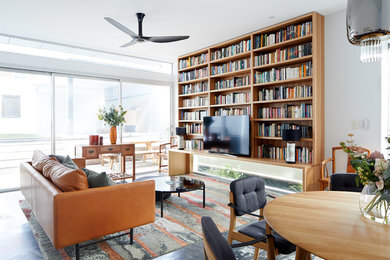 Global urban style living room with custom bookcase