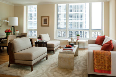 Example of a mid-sized transitional open concept medium tone wood floor living room design in Chicago with beige walls, no fireplace and no tv