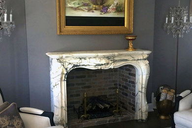 Inspiration for a large victorian formal and open concept carpeted living room remodel in Boston with gray walls, a standard fireplace, a stone fireplace and a wall-mounted tv
