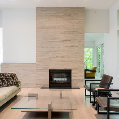 Inspiration for a mid-sized scandinavian formal and enclosed light wood floor living room remodel in Minneapolis with white walls, a standard fireplace, no tv and a tile fireplace