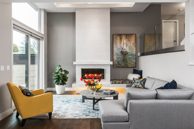 Living room - mid-sized contemporary formal and open concept dark wood floor and brown floor living room idea in Vancouver with gray walls, a ribbon fireplace, no tv and a plaster fireplace