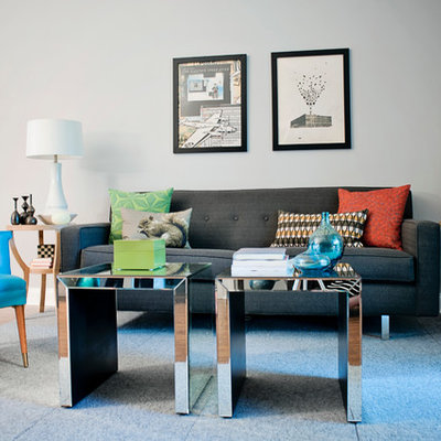 Living room - large eclectic open concept dark wood floor living room idea in Other with gray walls and no fireplace