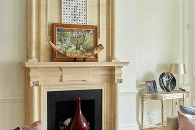 This is an example of a medium sized victorian enclosed living room in London with white walls, medium hardwood flooring, a standard fireplace, a stone fireplace surround and brown floors.
