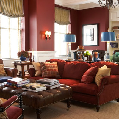 Elegant living room photo in New York with red walls