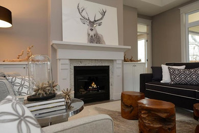Inspiration for a large transitional formal and open concept medium tone wood floor and brown floor living room remodel in Toronto with beige walls, no tv, a standard fireplace and a tile fireplace