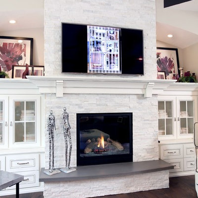 Living room - mid-sized transitional open concept medium tone wood floor living room idea in Grand Rapids with beige walls, a standard fireplace, a tile fireplace and a wall-mounted tv