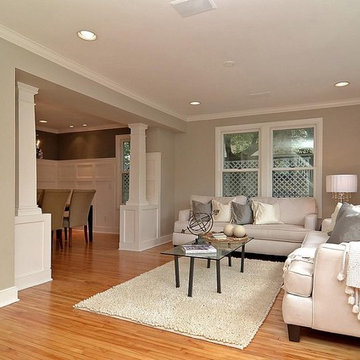 Gray/Grey Living Room Looking Into Dining Room With Wainscot And Columns