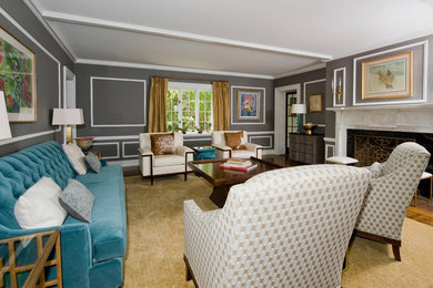 Пример оригинального дизайна: парадная, изолированная гостиная комната среднего размера в стиле неоклассика (современная классика) с серыми стенами, паркетным полом среднего тона, стандартным камином, фасадом камина из камня и коричневым полом без телевизора
