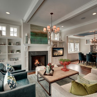 Example of a classic formal and enclosed living room design in Minneapolis with beige walls, a standard fireplace and no tv