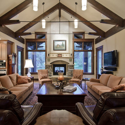 Living room - traditional living room idea in Denver with a stone fireplace