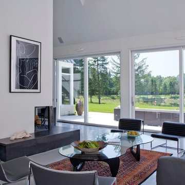 Great Room in Contemporary European Farmhouse Featuring Lift and Slide Doors