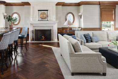 Living room - huge traditional enclosed medium tone wood floor and brown floor living room idea in Newark with a bar, gray walls, a standard fireplace, a stone fireplace and a media wall