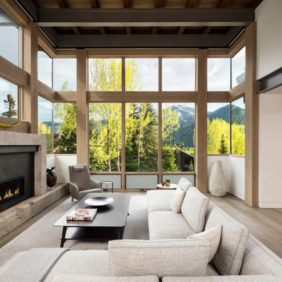 Example of a large mountain style formal and open concept light wood floor living room design in Salt Lake City with white walls, a ribbon fireplace, a metal fireplace and no tv