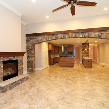 Great Room with Stone Fireplace and Archway