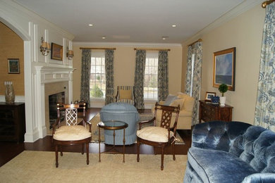 Example of a large classic open concept dark wood floor living room design in Boston with yellow walls, a standard fireplace and a tile fireplace