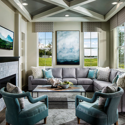 Example of a mid-sized transitional formal and enclosed dark wood floor and brown floor living room design in Denver with beige walls, a standard fireplace, a tile fireplace and a wall-mounted tv