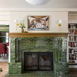 Example of an arts and crafts formal and enclosed medium tone wood floor and brown floor living room design in Los Angeles with beige walls, a tile fireplace, no tv and a standard fireplace