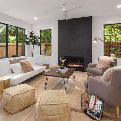 Example of a mid-sized transitional formal and enclosed light wood floor and beige floor living room design in Seattle with white walls, a ribbon fireplace, a tile fireplace and no tv