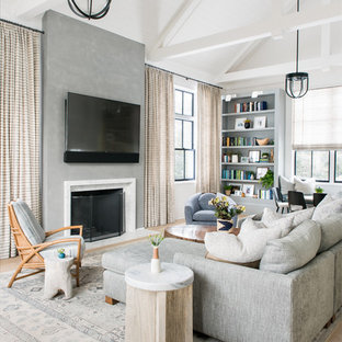 Inspiration for a country light wood floor and beige floor living room remodel in New York with white walls, a standard fireplace and a wall-mounted tv