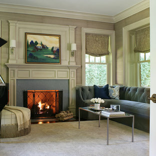 Example of a mid-sized classic enclosed dark wood floor living room design in New York with a music area, beige walls, a standard fireplace, no tv and a stone fireplace