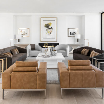 Living room - modern enclosed light wood floor and beige floor living room idea in Los Angeles with white walls and a ribbon fireplace