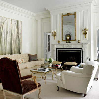 Example of a classic formal and enclosed living room design in New York with beige walls and a standard fireplace