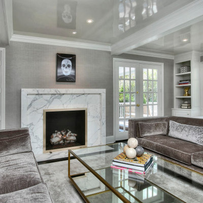 Inspiration for a large transitional enclosed dark wood floor and black floor living room remodel in New York with gray walls, a standard fireplace, a stone fireplace and no tv