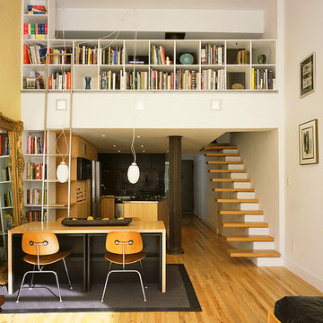 greenwich village loft with custom bookcases and library ladder