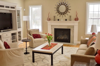 Example of a large transitional open concept light wood floor living room design with beige walls, a standard fireplace, a stone fireplace and a media wall