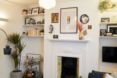 Design ideas for a victorian living room in London with white walls and a two-sided fireplace.