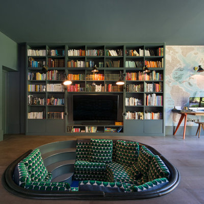 Inspiration for a mid-sized contemporary enclosed gray floor living room remodel in London with green walls, a wall-mounted tv and no fireplace