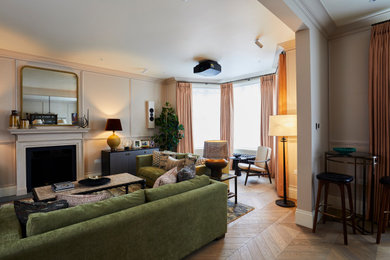 Example of a transitional living room design in London