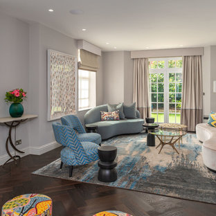 Photo of a large contemporary formal living room in London with grey walls, brown floors and dark hardwood flooring.