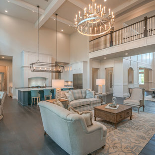 Living room - large coastal formal and open concept dark wood floor and brown floor living room idea in Houston with white walls, a standard fireplace, a tile fireplace and a wall-mounted tv