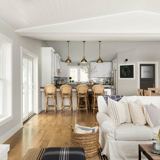 Farmhouse living room photo in Minneapolis with gray walls and a brick fireplace