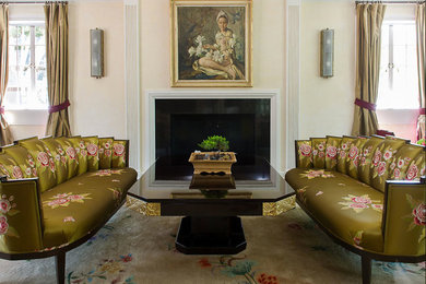 Example of an ornate formal living room design in Los Angeles with yellow walls, a standard fireplace and no tv