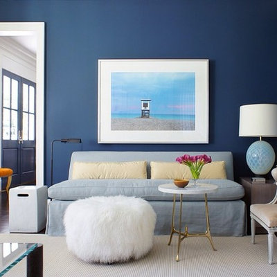 Inspiration for a large contemporary formal carpeted living room remodel in New York with blue walls, a standard fireplace, a stone fireplace and no tv