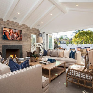 Living room - eclectic light wood floor living room idea in Orange County with white walls and a wall-mounted tv